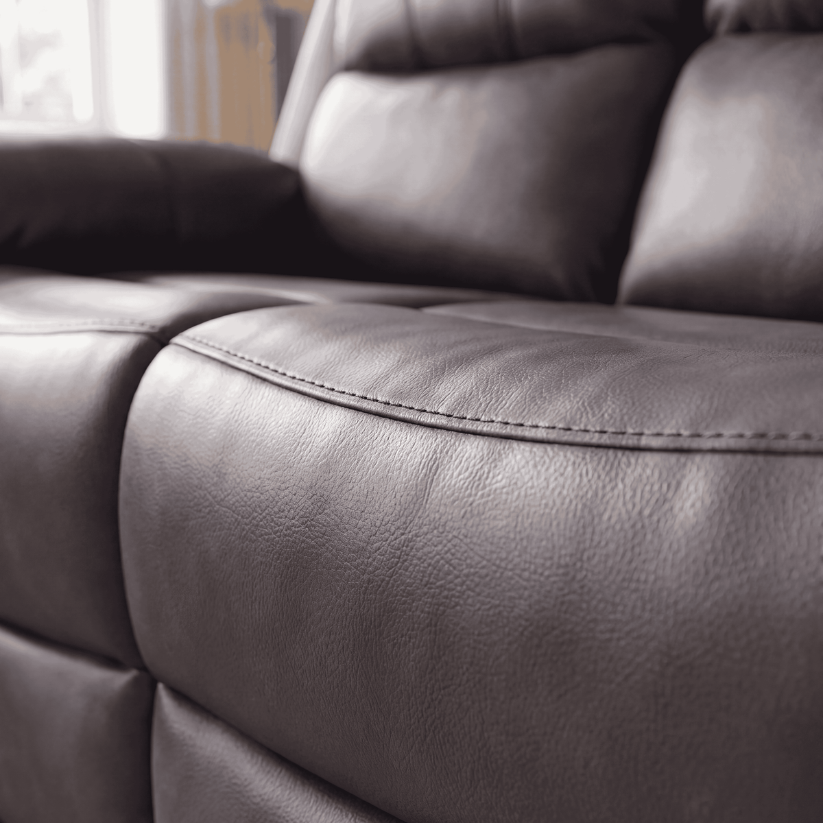 Belgravia recliner in medium grey, close up of the stitched seat cushion