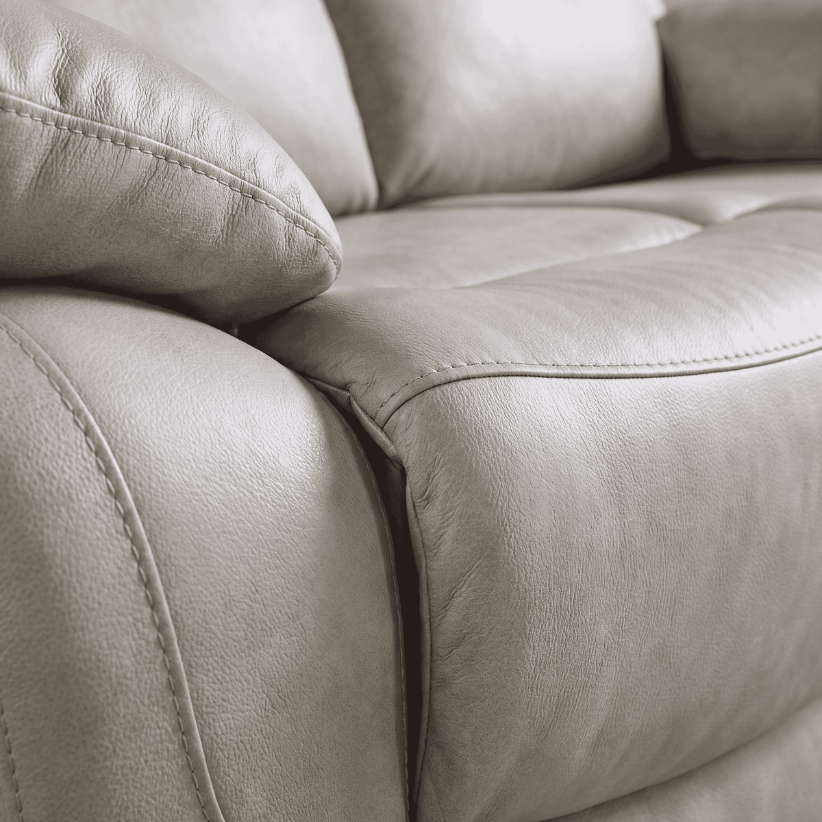 Belgravia recliner in light grey, close up of the leather-look upholstery